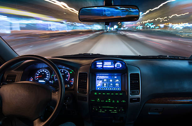 Driving car at night stock photo