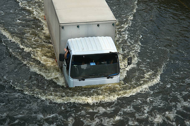 Driving Car in Flood Water at Bangkok, Thailand stock photo