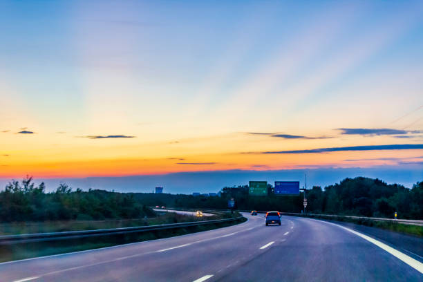 Driving from Denmark to Sweden at a beautiful colorful sunrise or sunset. stock photo