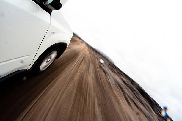 driving in the rock desert - motion blur. dangerous road stock photo