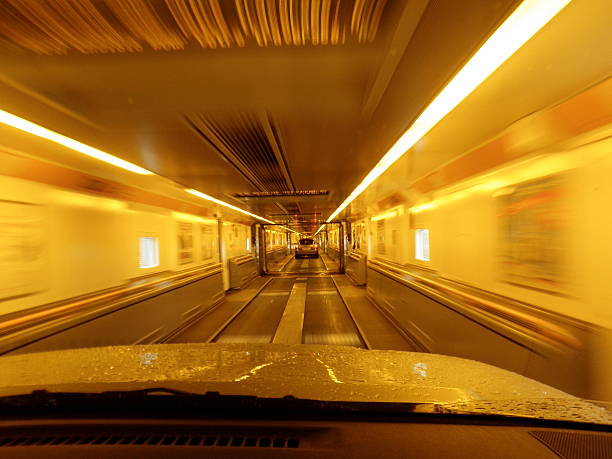 Driving through car transporter Driving through a car transporter on the Euro Tunnel  normalisaverage stock pictures, royalty-free photos & images