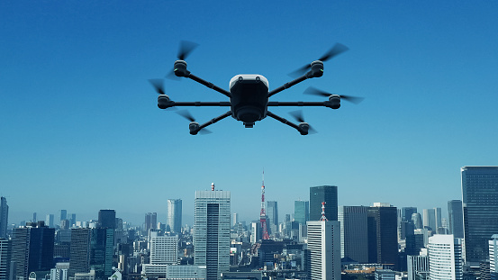 Drone flying above modern city. 3D rendering.
