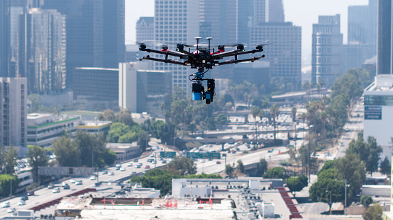Large drone flying over construction site in downtown Los Angeles