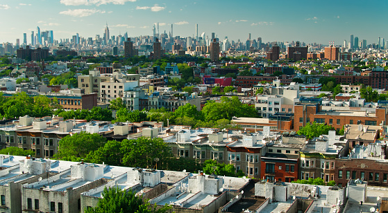 Aerial shot of New York City on a sunny afternoon in summer from over the Crown Heights neighborhood in Brooklyn.