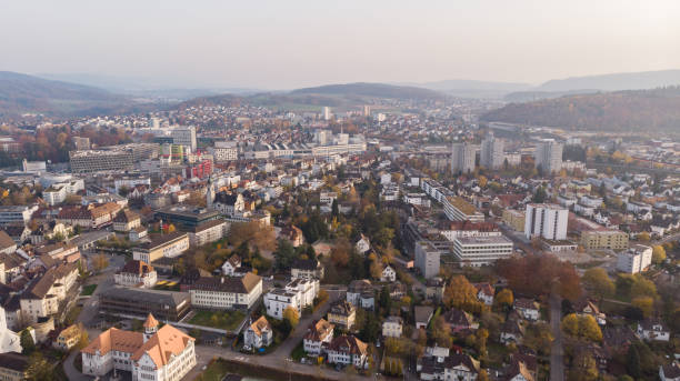 Drone view of cityscape Brugg with residential and commercial districts, historic old town and Windisch in canton Aargau in Switzerland. Drone view of cityscape Brugg with residential and commercial districts, historic old town and Windisch in canton Aargau in Switzerland. Town situated on feet of Tafeljura. aargau canton stock pictures, royalty-free photos & images