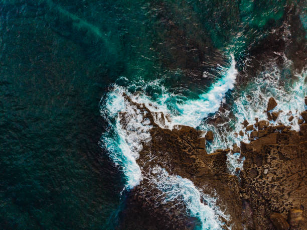 Drone View of Waves Crashing on the Rocks of the Algarve Cliffs, Portugal stock photo