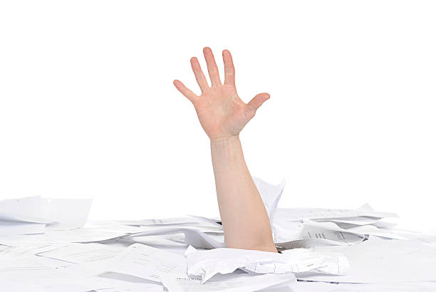 drowning in paperwork stock photo