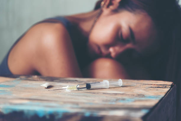 Drug abuse, women taking drugs,  Closeup picture of drug addict.  Women having life issue and use drugs to forget thing. Drug abuse, women taking drugs,  Closeup picture of drug addict.  Women having life issue and use drugs to forget thing. heroin stock pictures, royalty-free photos & images