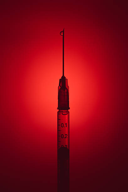 Drug syringe with liquid heroin powder with danger color concept. Drug syringe with liquid heroin powder with danger color concept. heroin stock pictures, royalty-free photos & images