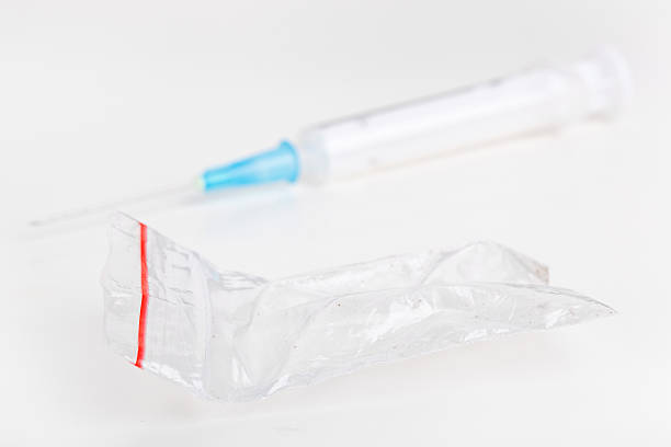 Drugs problem Syringe and pocket closeup on white background mephedrone stock pictures, royalty-free photos & images
