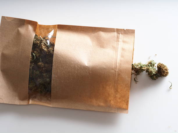 dry flowers medical marijuana in paper bag stock photo