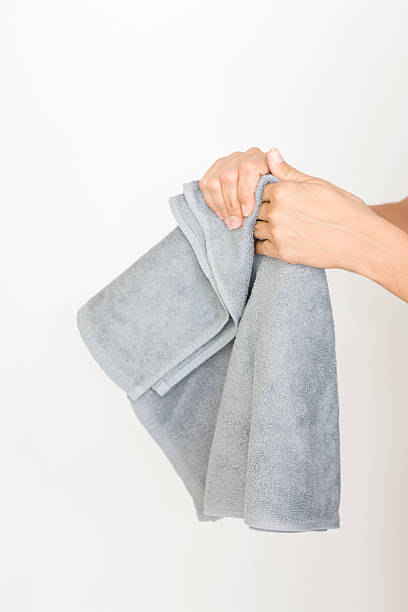 Drying hands with a towel stock photo