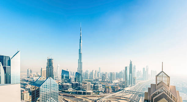 Dubai skyline down town district cityscape The new Dubai down town district with the Burj Khalifa rising above the ultra modern skyline. burj khalifa stock pictures, royalty-free photos & images