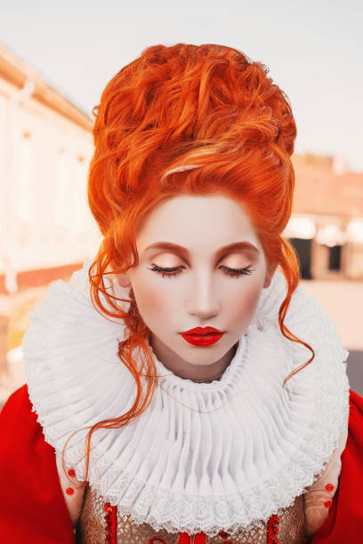 Duchess look down. Young baroque redhead queen portrait with historical hairstyle. Renaissance princess with red hair. Fairytale queen in red dress. Baroque duchess. Rococo hairdo. White collar  victorian gown stock pictures, royalty-free photos & images