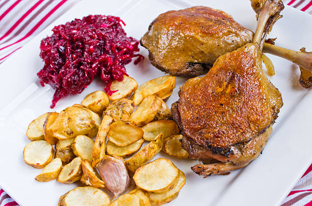 Duck confit with beetroots and jerusalem artichokes fries stock photo