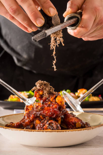 Duck wings and black truffle stock photo