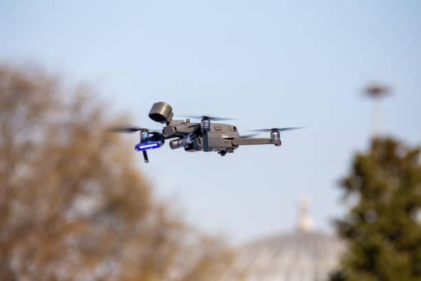 Due to coronavirus interventions,the police warned people on the street to stay at home with a special drone. stock photo