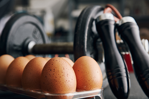 Dumbbell And Eggs Stock Photo - Download Image Now - Animal Egg, Egg, Gym - iStock