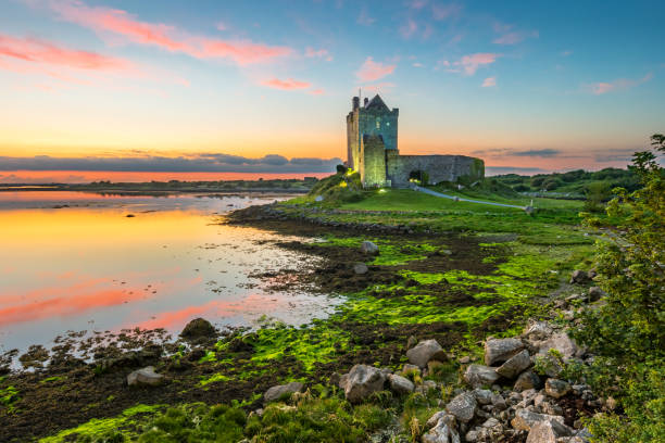 Dunguaire Castle on shores of Galway Bay Ireland Dunguaire Castle on the shores of Galway Bay Ireland during a beautiful sunset ireland stock pictures, royalty-free photos & images