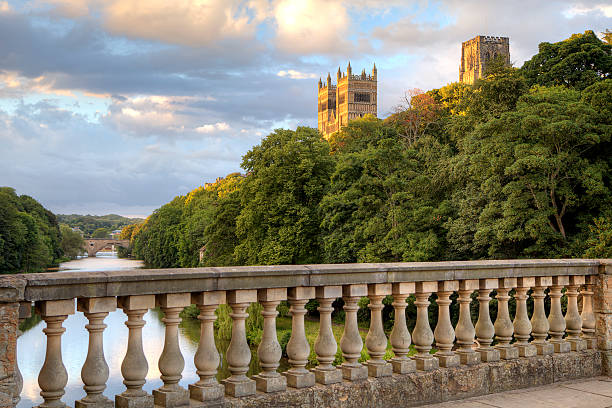 Durham Cathedral from Prebends Bridge The view of Durham Cathedral, England, as seen from the Prebends Bridge on a sunny evening. Durham Cathedral stock pictures, royalty-free photos & images