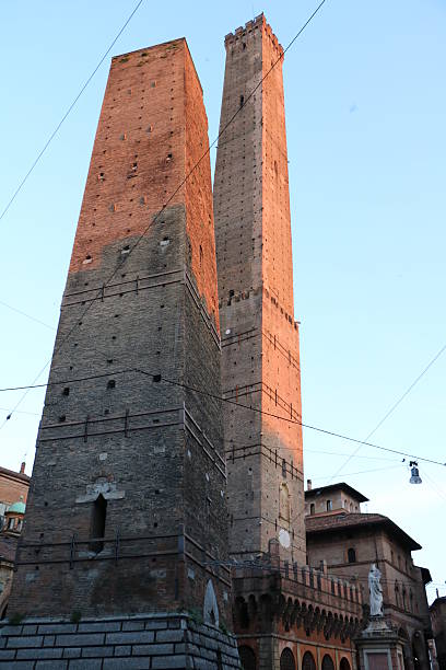 Dusk "Garisenda" and "Asinelli" Two Towers of Bologna in Italy stock photo