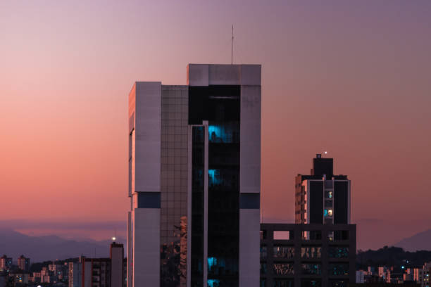 Dusk with a view of a building in the big city stock photo