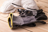 istock Dust masks, goggles and protective gloves. Personal protective equipment for workers 1319658101