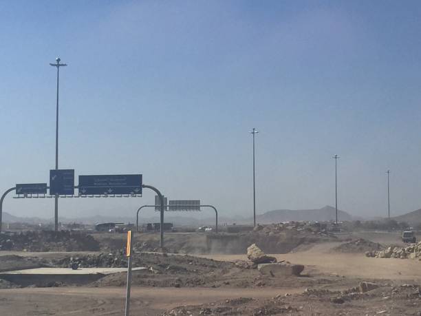 Dusty road intersection in Saudi Arabia stock photo