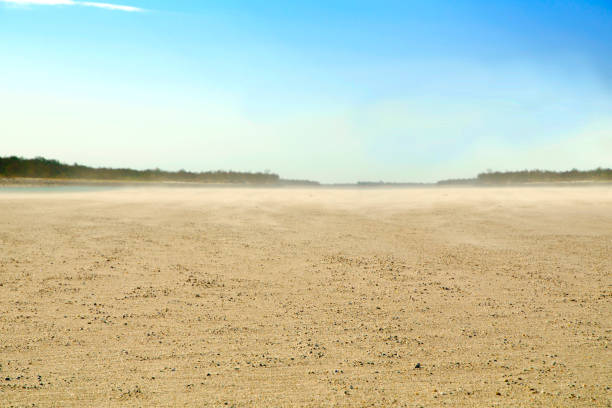 Dusty shore River bank with sand in the air dirt road stock pictures, royalty-free photos & images