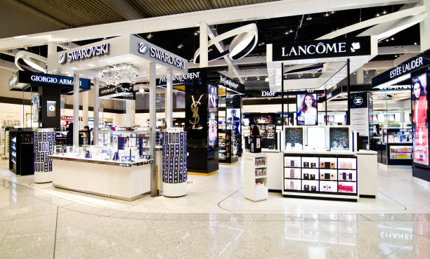 duty free shops at Eleftherios Venizelos airport in Athens Greece ATHENS GREECE AIRPORT, DECEMBER 13 2015: duty free shops at Eleftherios Venizelos airport in Athens Greece, swarovski, lancome, dior shops, Editorial use. brand name stock pictures, royalty-free photos & images