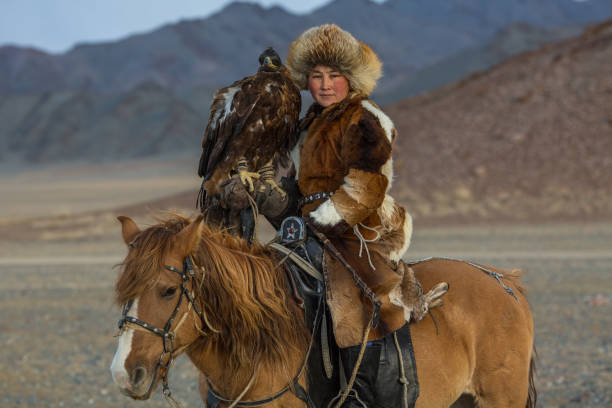 Eagle Hunter in desert mountain of Western Mongolia. stock photo