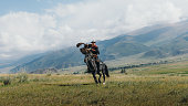 istock Eagle Hunter in traditional costume riding horse with Golden Eagle in the mountains of Central Asia 1343808465