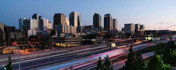 Early Morning Commuters Create Light Trails Before Rush Hour in Bellevue Washington The light of dawn begins to illuminate the buildings and architecture of Bellevue Washington king county washington state stock pictures, royalty-free photos & images