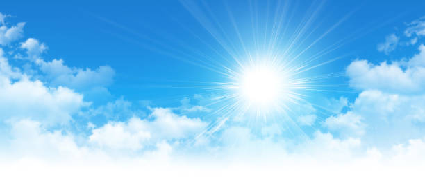 Early sunshine in a cloudy blue sky Early morning blue sky, shining sun rising up and breaking through white clouds appearance stock pictures, royalty-free photos & images