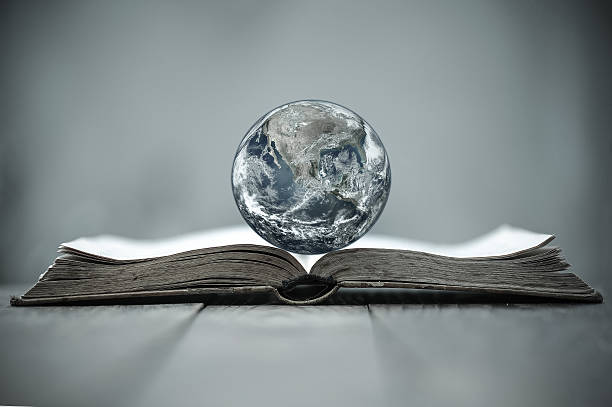 Earth globe on a book stock photo