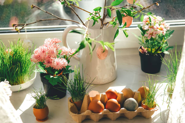 Easter decor. Windowsill with pink Easter eggs. stock photo