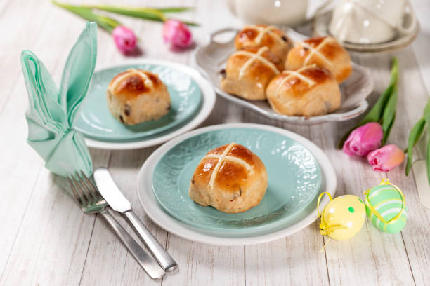 Easter festive dessert table with hot cross buns stock photo