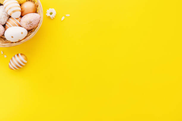 Easter Flat Lay of Eggs on yellow stock photo