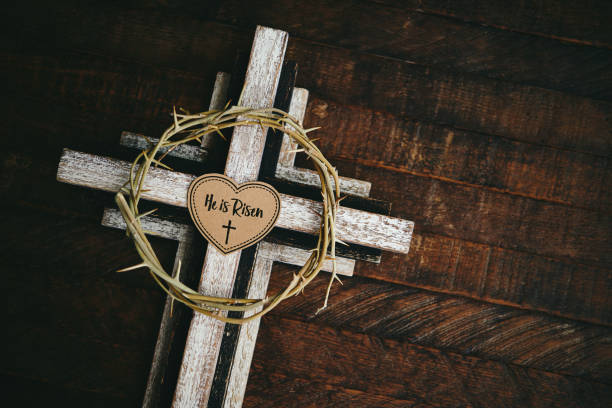 Easter religious background. Cross with He is Risen message  easter sunday stock pictures, royalty-free photos & images