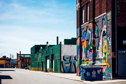 Detroit, Michigan, USA- April 24, 2016: Colourful warehouses in famous Eastern Market district in Detroit. Local and internationally recognised art galleries, studios and other creative spaces have recently established nearby.