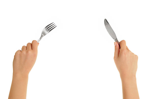 eating isolated on white hands holding knife and fork table knife stock pictures, royalty-free photos & images