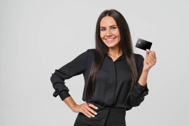 E-banking, e-commerce. Businesswoman bank manager employee worker ceo boss using credit card for online payments, shopping, loan, startup, mortgage, cashback isolated in white background stock photo