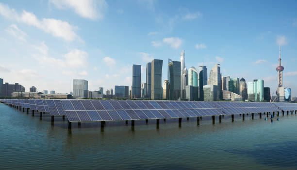 Eco-environmentally friendly green energy of sustainable development of solar power plant with Shanghai skyline stock photo