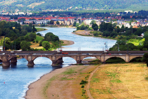 Ecological problem, shallow river Elbe in the area of the city of Dresden, Germany. Albert bridge Ecological problem, shallow river Elbe in the area of the city of Dresden, Germany. Albert bridge elbe river stock pictures, royalty-free photos & images