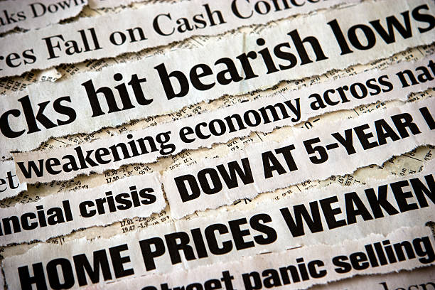 Economic headlines surrounding each other stock photo