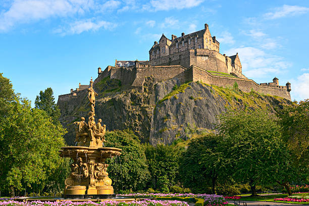 Edinburgh Castle, Scotland, from Princes Street Gardens, with Ross Fountain Edinburgh Castle, Scotland, from Princes Street Gardens, with the Ross Fountain in the foreground local landmark stock pictures, royalty-free photos & images
