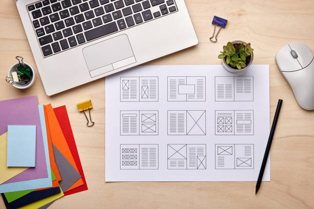 Editorial designer desk with publication layout Editorial design. Graphic designer desk with magazine layout designs. Flat lay editorial photos stock pictures, royalty-free photos & images