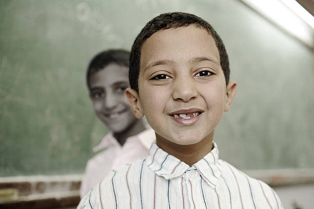 Education activities in classroom at school, happy arabic children,...
