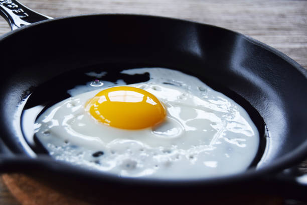 Egg in pan stock photo
