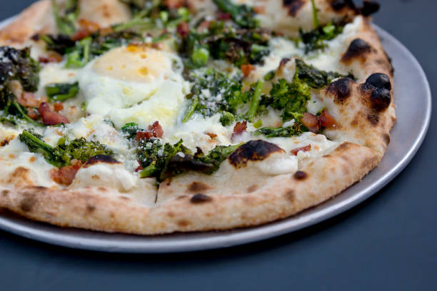 Egg, Pancetta & Broccoli Pizza stock photo